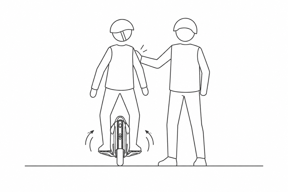 Beginner riding an electric unicycle with light support